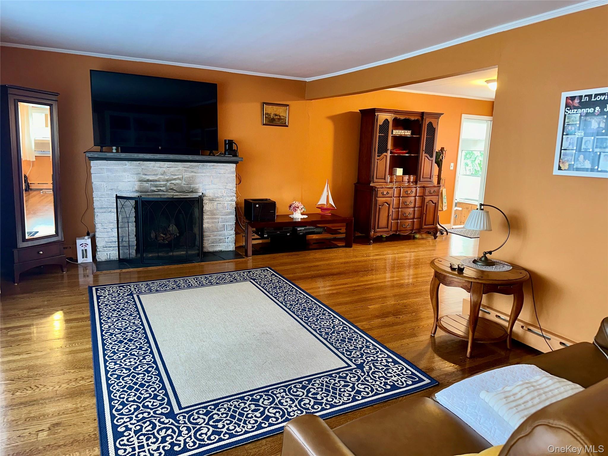 406 Moriches Road St. James, NY 11780 - Photo 8 of 28 a living room with furniture rug and a fireplace