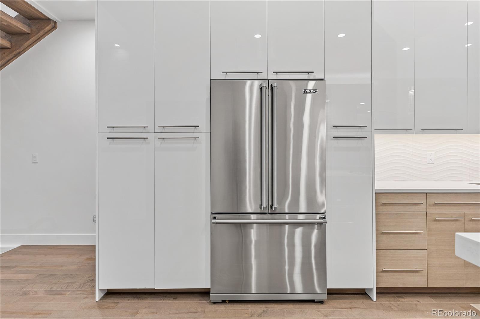 3535 Tejon Street Denver, CO 80211 - Photo 14 of 50 a view of kitchen with stainless steel appliances wooden floor
