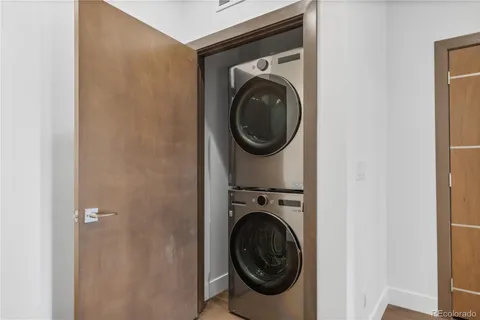 a view of a hallway with washer and dryer