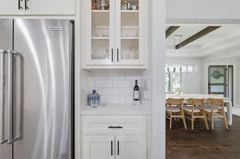 a view of dining table with chairs
