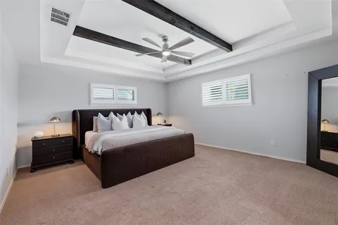 a bedroom with bed and window