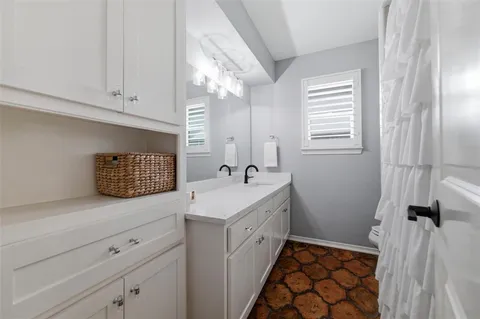 a utility room with a sink dryer and washer