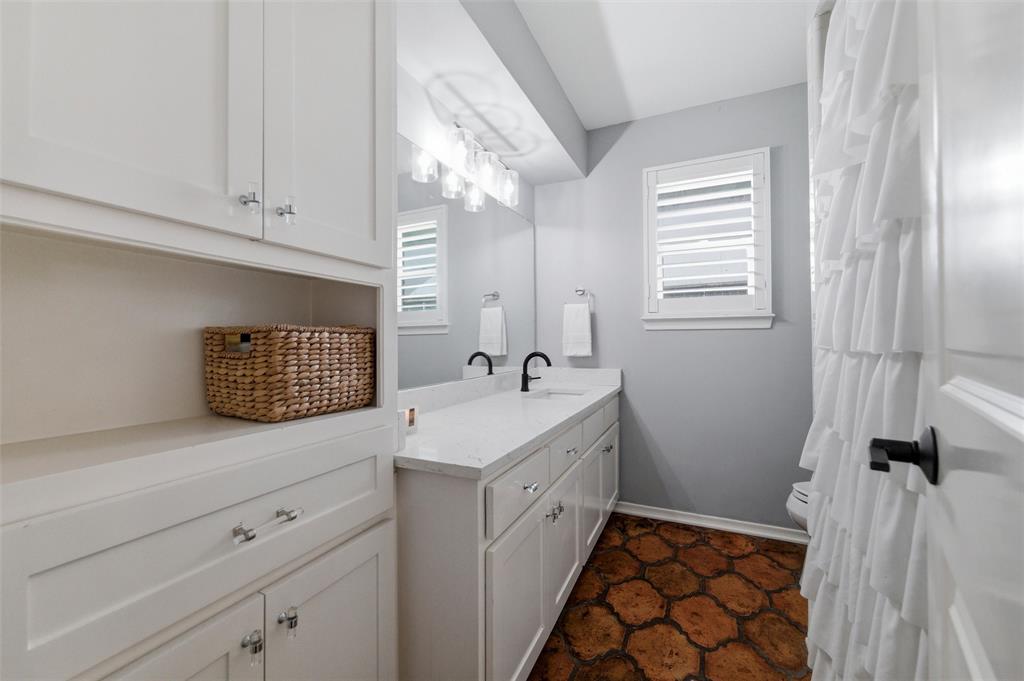 10717 Ferndale Road Dallas, TX 75238 - Photo 22 of 36 a utility room with a sink dryer and washer