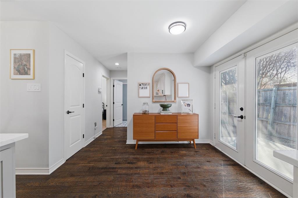 10717 Ferndale Road Dallas, TX 75238 - Photo 30 of 36 a room with furniture and a wooden floor