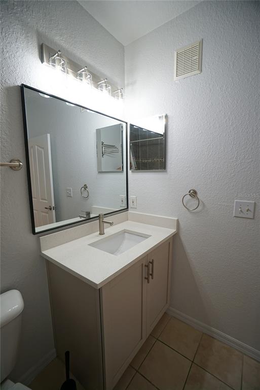 5000 Culbreath Key Way, Unit 8214 Tampa, FL 33611 - Photo 11 of 16 a bathroom with a sink and a mirror