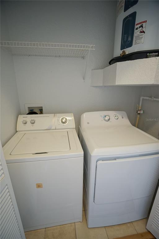 5000 Culbreath Key Way, Unit 8214 Tampa, FL 33611 - Photo 12 of 16 a utility room with dryer and washer