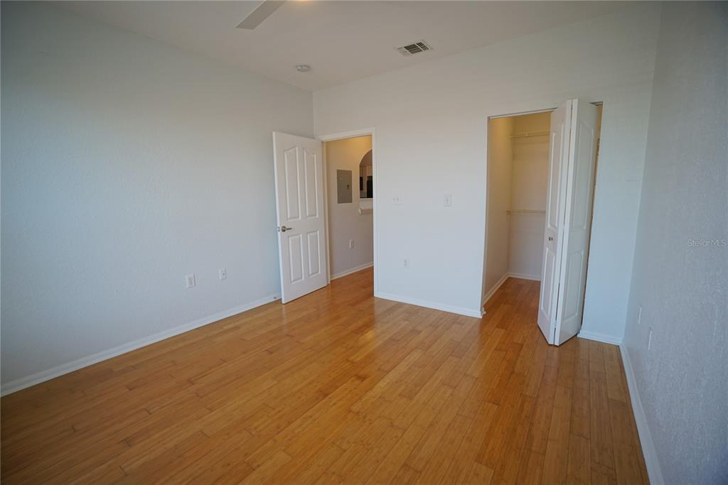 5000 Culbreath Key Way, Unit 8214 Tampa, FL 33611 - Photo 14 of 16 a view of empty room with wooden floor
