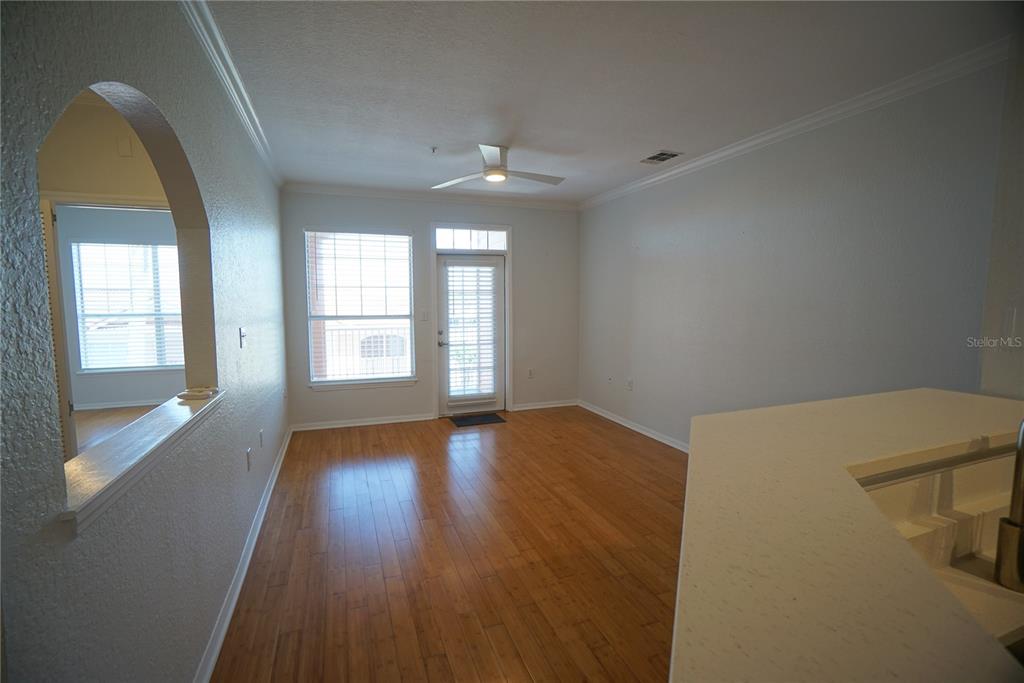 5000 Culbreath Key Way, Unit 8214 Tampa, FL 33611 - Photo 6 of 16 wooden floor in an empty room with a window