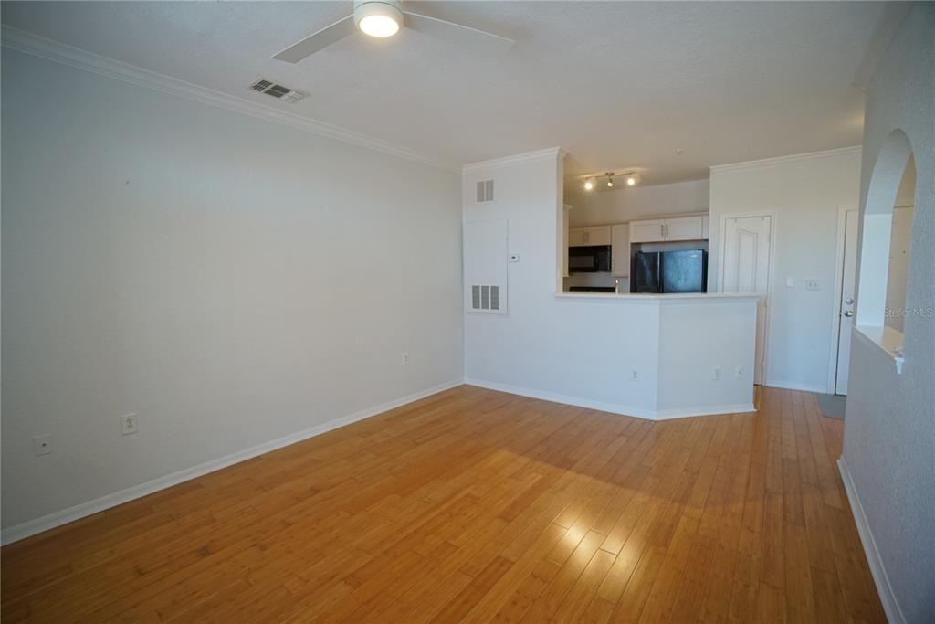 5000 Culbreath Key Way, Unit 8214 Tampa, FL 33611 - Photo 7 of 16 a view of empty room with wooden floor