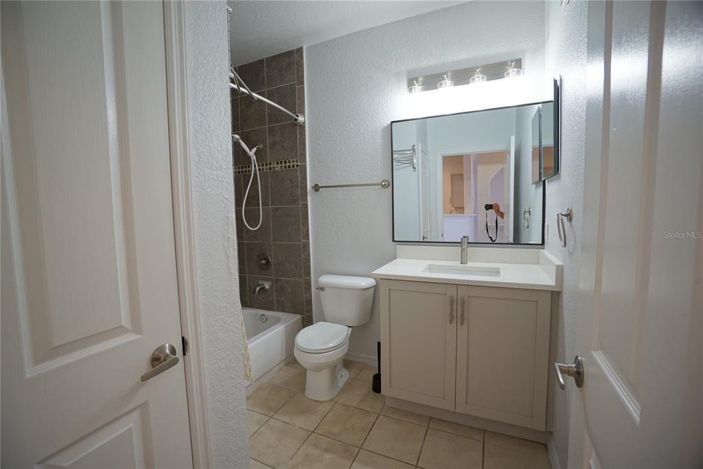 5000 Culbreath Key Way, Unit 8214 Tampa, FL 33611 - Photo 9 of 16 a bathroom with a toilet sink and mirror