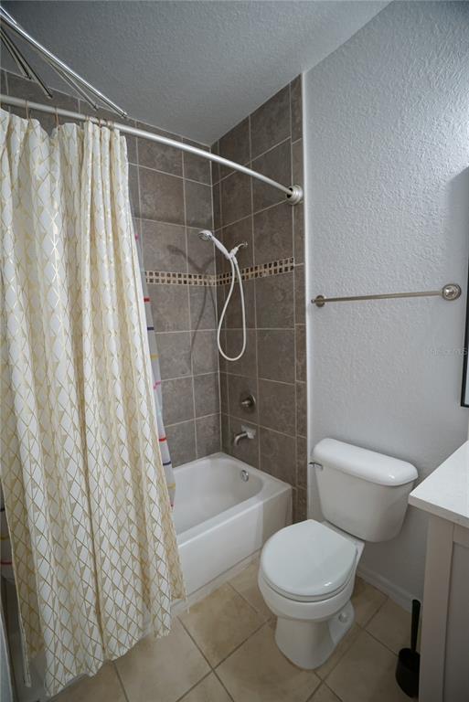 5000 Culbreath Key Way, Unit 8214 Tampa, FL 33611 - Photo 10 of 16 a bathroom with a shower toilet and sink