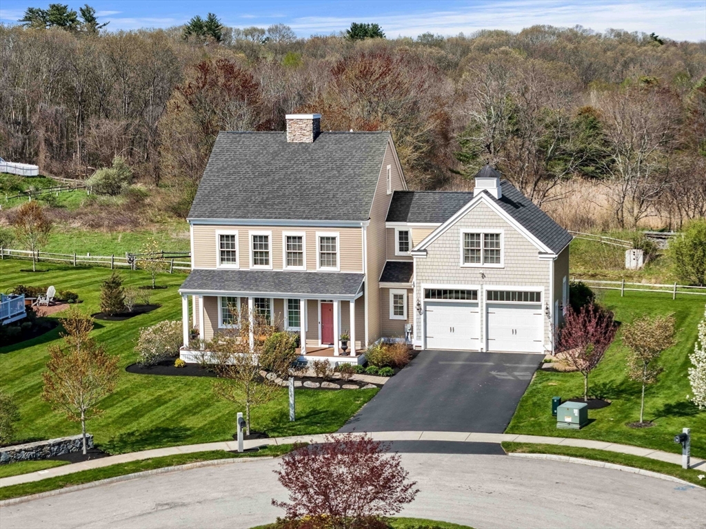 4 Point Shore Overlook Amesbury, MA 01913 - Photo 41 of 42 a view of a white house next to a yard with large trees
