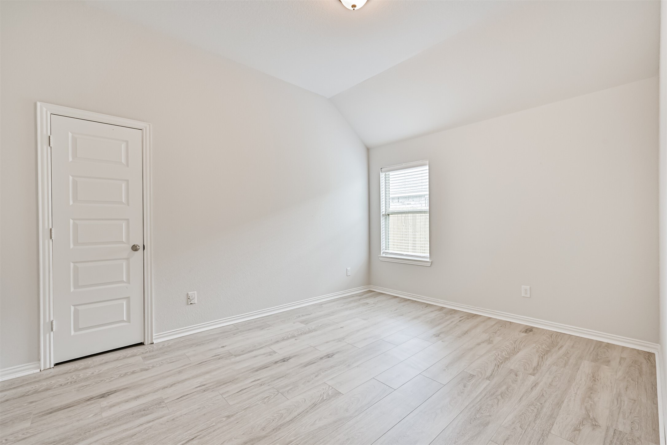 7019 Terra Drive Manvel, TX 77578 - Photo 30 of 41 an empty room with wooden floor and window