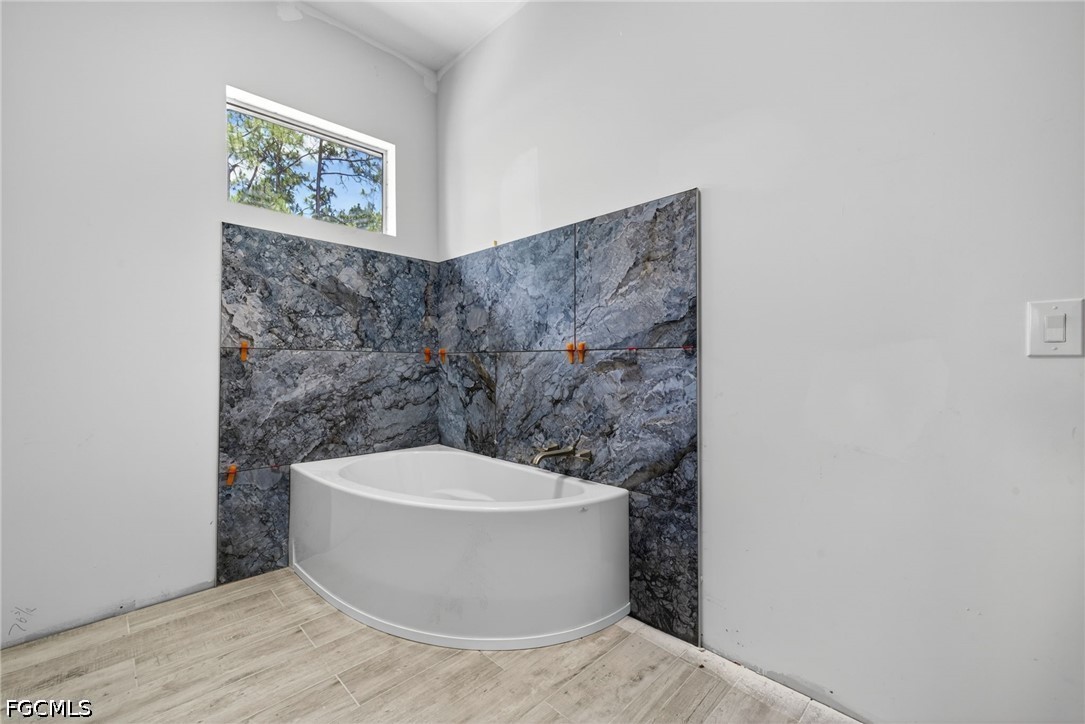 2665 Oil Well Road Naples, FL 34120 - Photo 30 of 40 a view of a bathtub in a bathroom