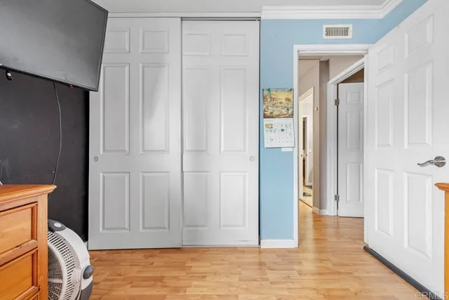 a view of room with window and wardrobe