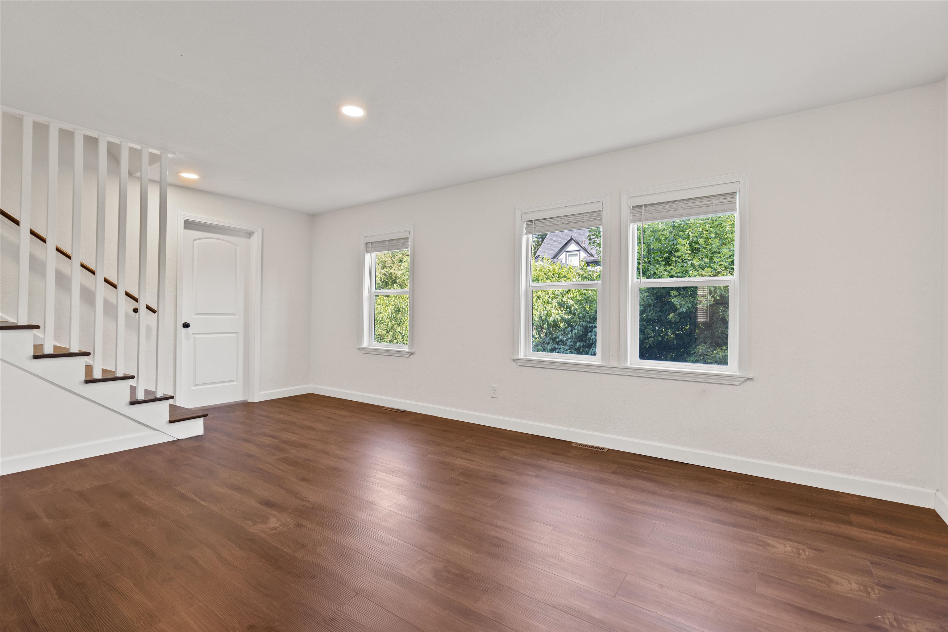 7330 Olde Creek Road Rockford, IL 61114 - Photo 2 of 20 a view of an empty room with wooden floor and a window