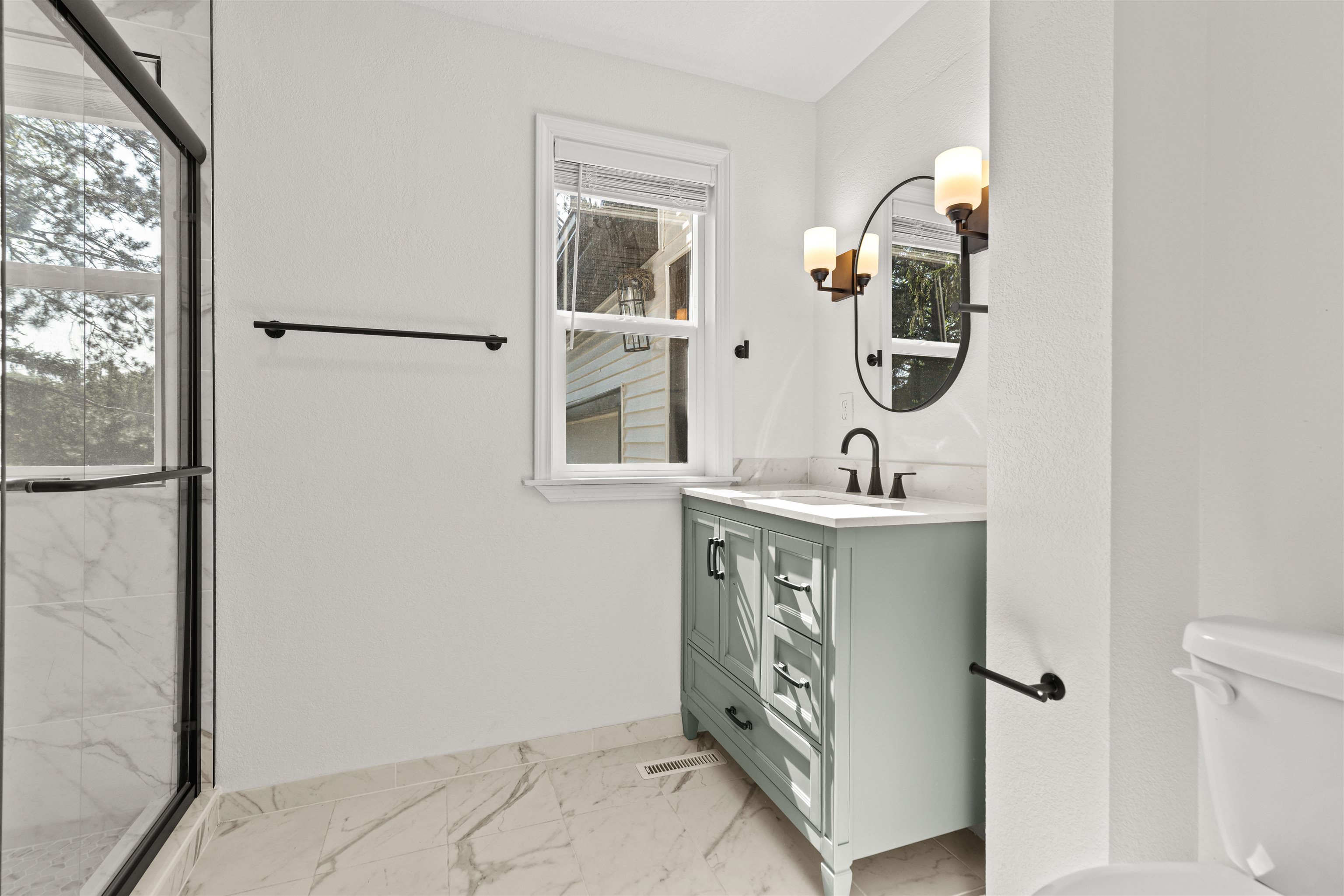 7330 Olde Creek Road Rockford, IL 61114 - Photo 5 of 20 a bathroom with a sink mirror and vanity