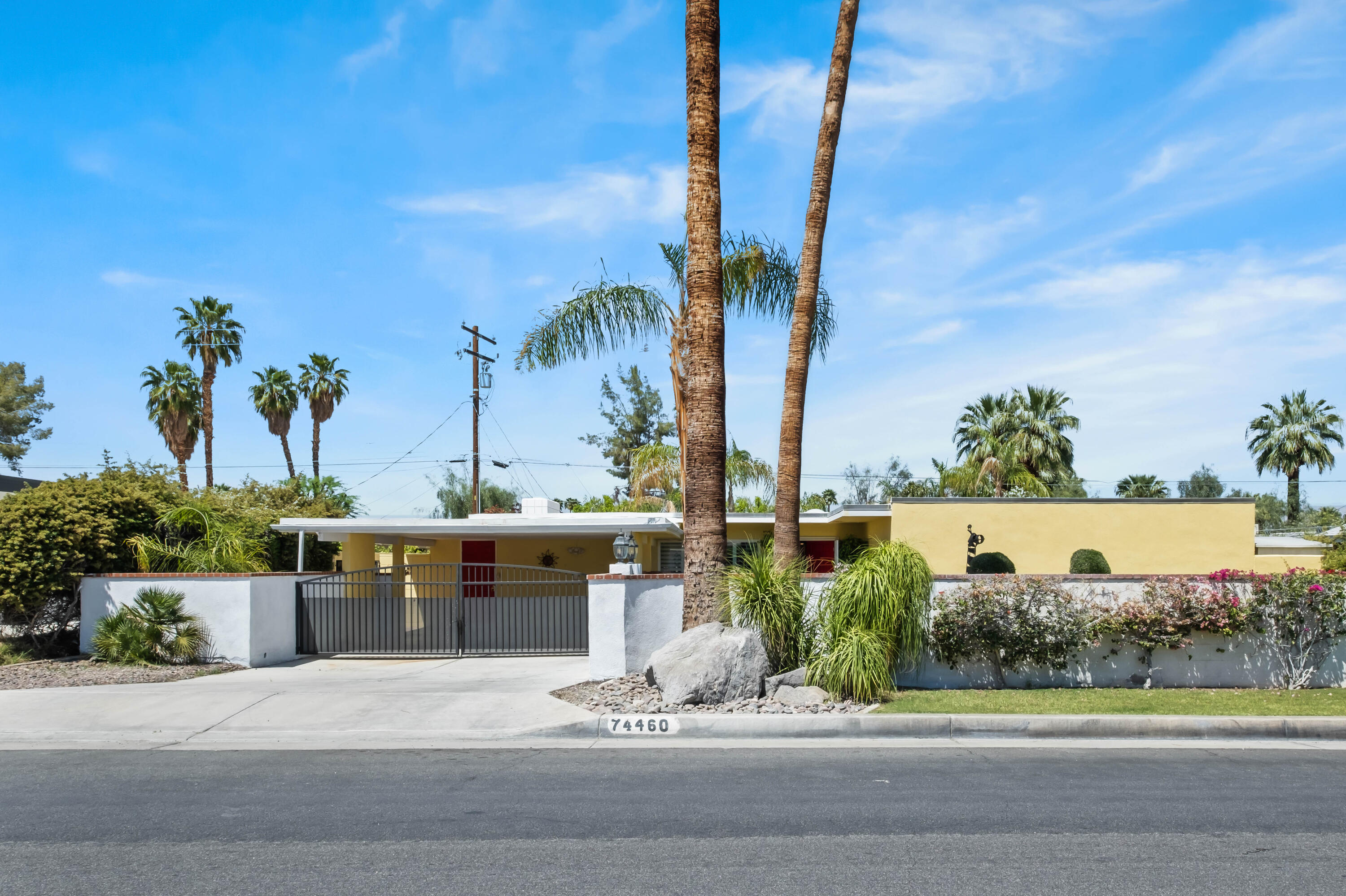 74460 Fairway Drive Palm Desert, CA 92260 - Photo 1 of 36 a view of a patio with a table and chairs