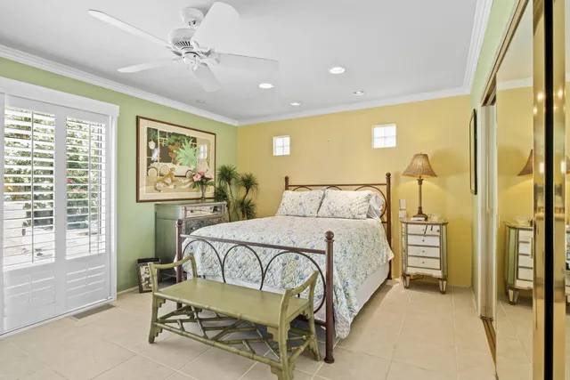 a bedroom with a bed chair and a window