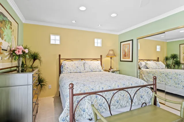 a spacious bedroom with a bed and a couch