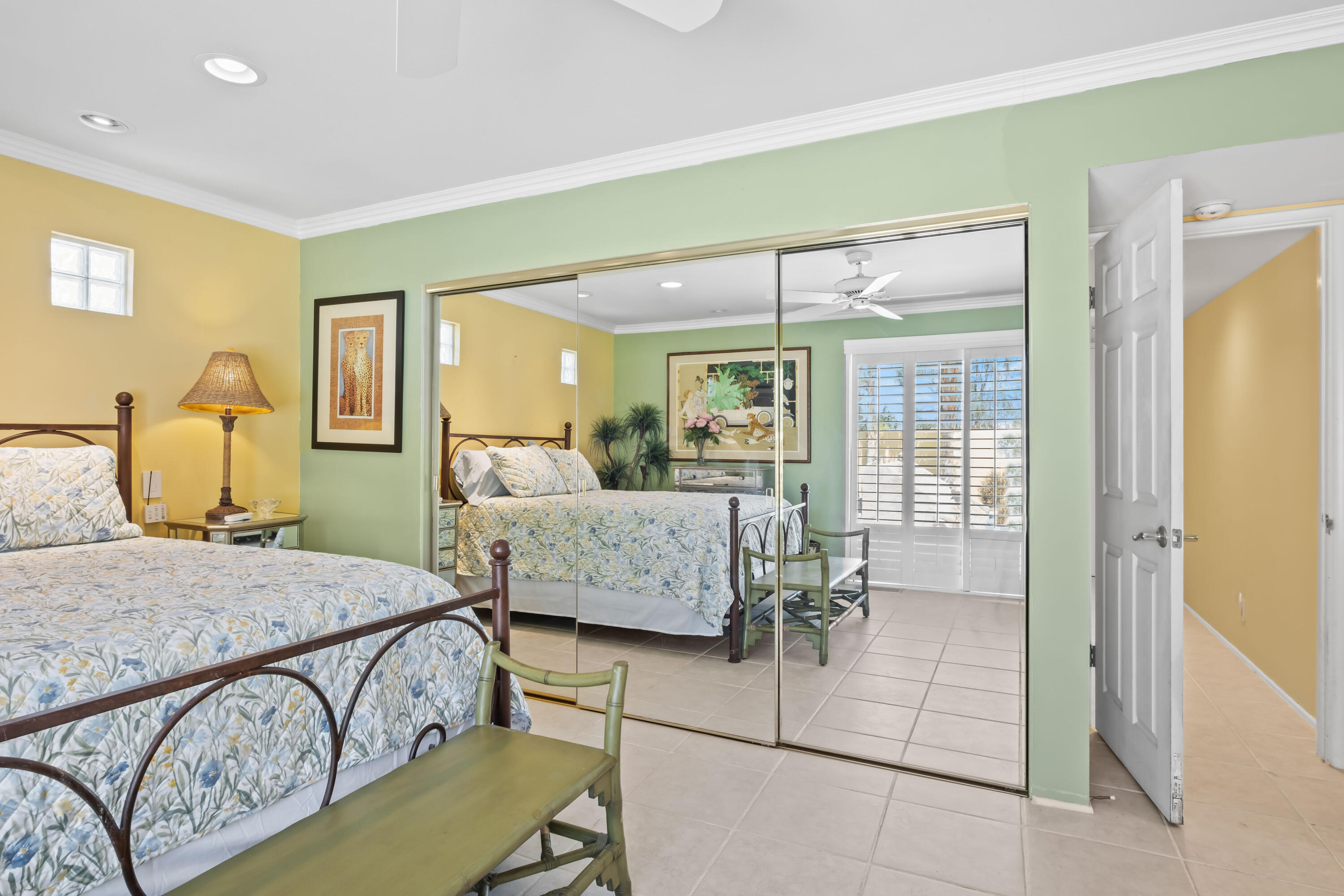 74460 Fairway Drive Palm Desert, CA 92260 - Photo 18 of 36 a bedroom with a bed couch and window