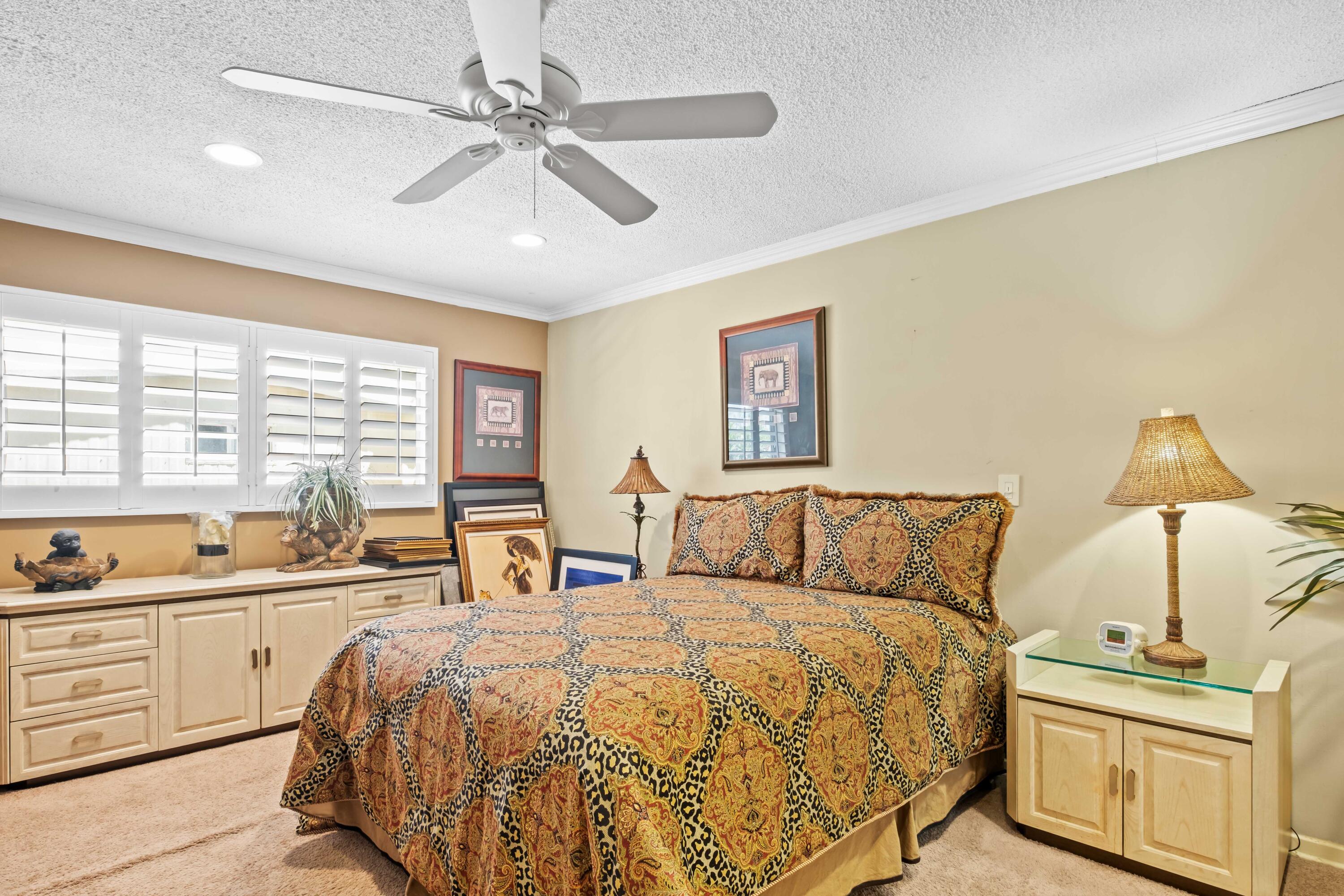 74460 Fairway Drive Palm Desert, CA 92260 - Photo 21 of 36 a bed room with a bed and a night stand