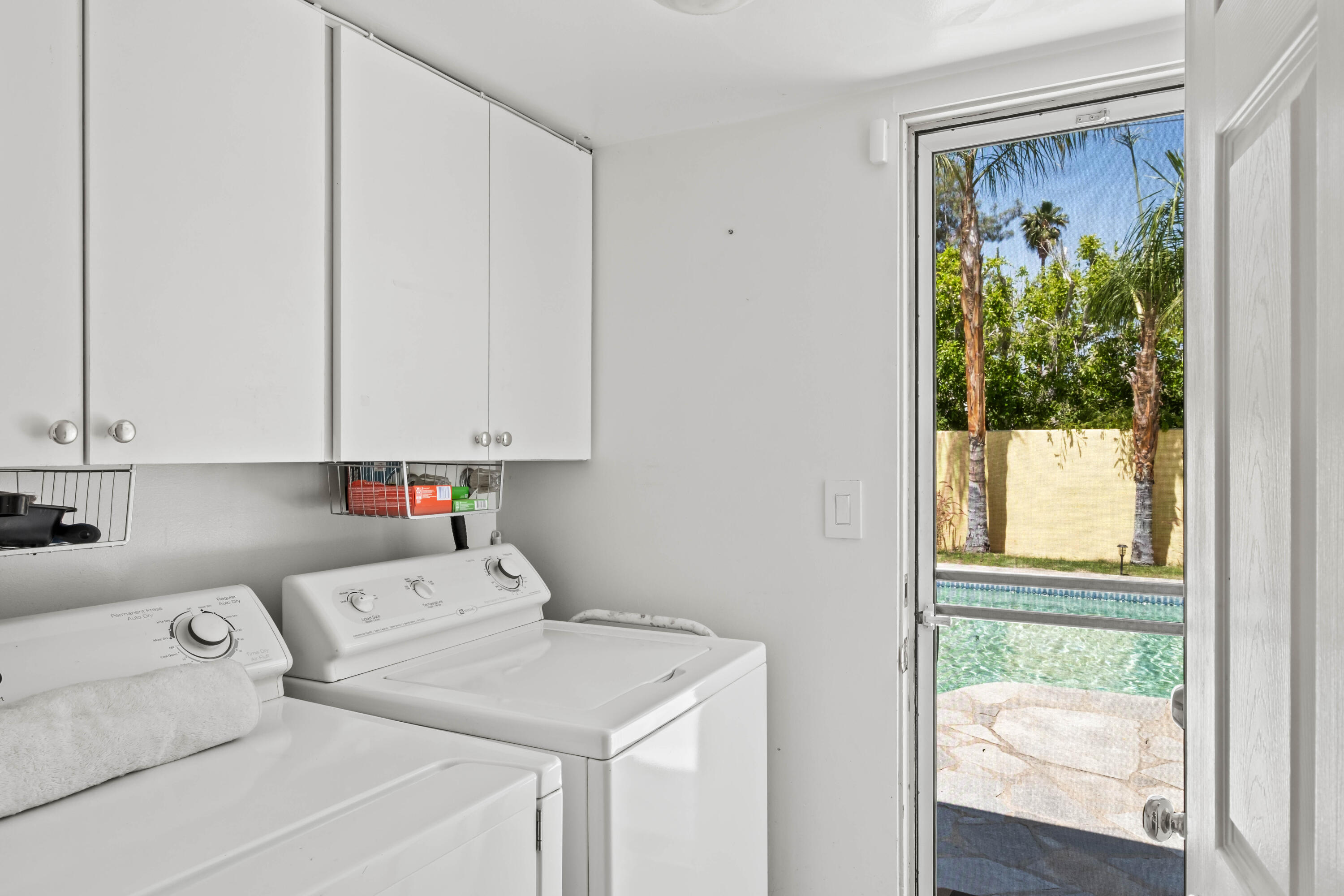 74460 Fairway Drive Palm Desert, CA 92260 - Photo 26 of 36 a utility room with dryer and washer