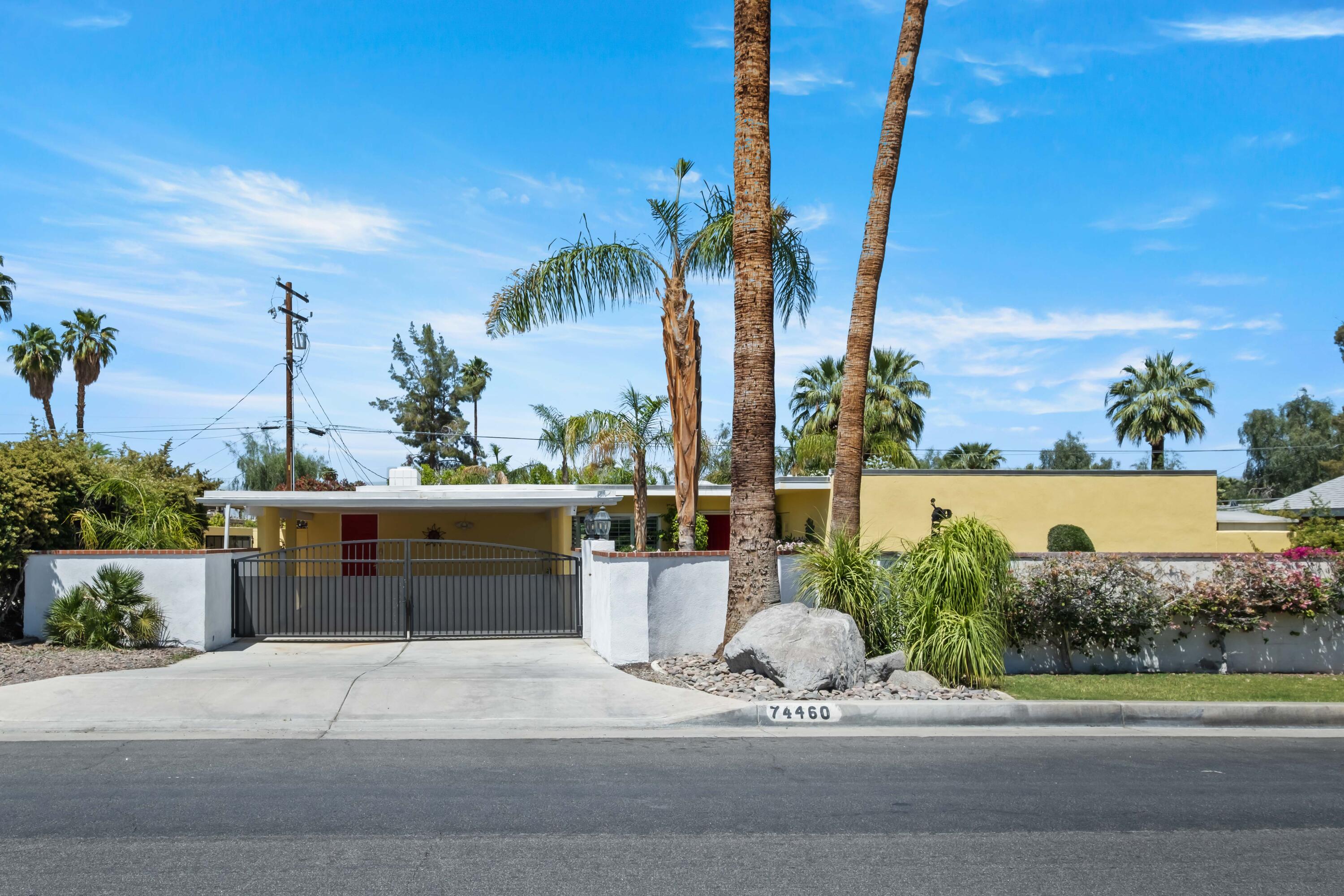 74460 Fairway Drive Palm Desert, CA 92260 - Photo 27 of 36 a front view of a house with fountain and ocean view