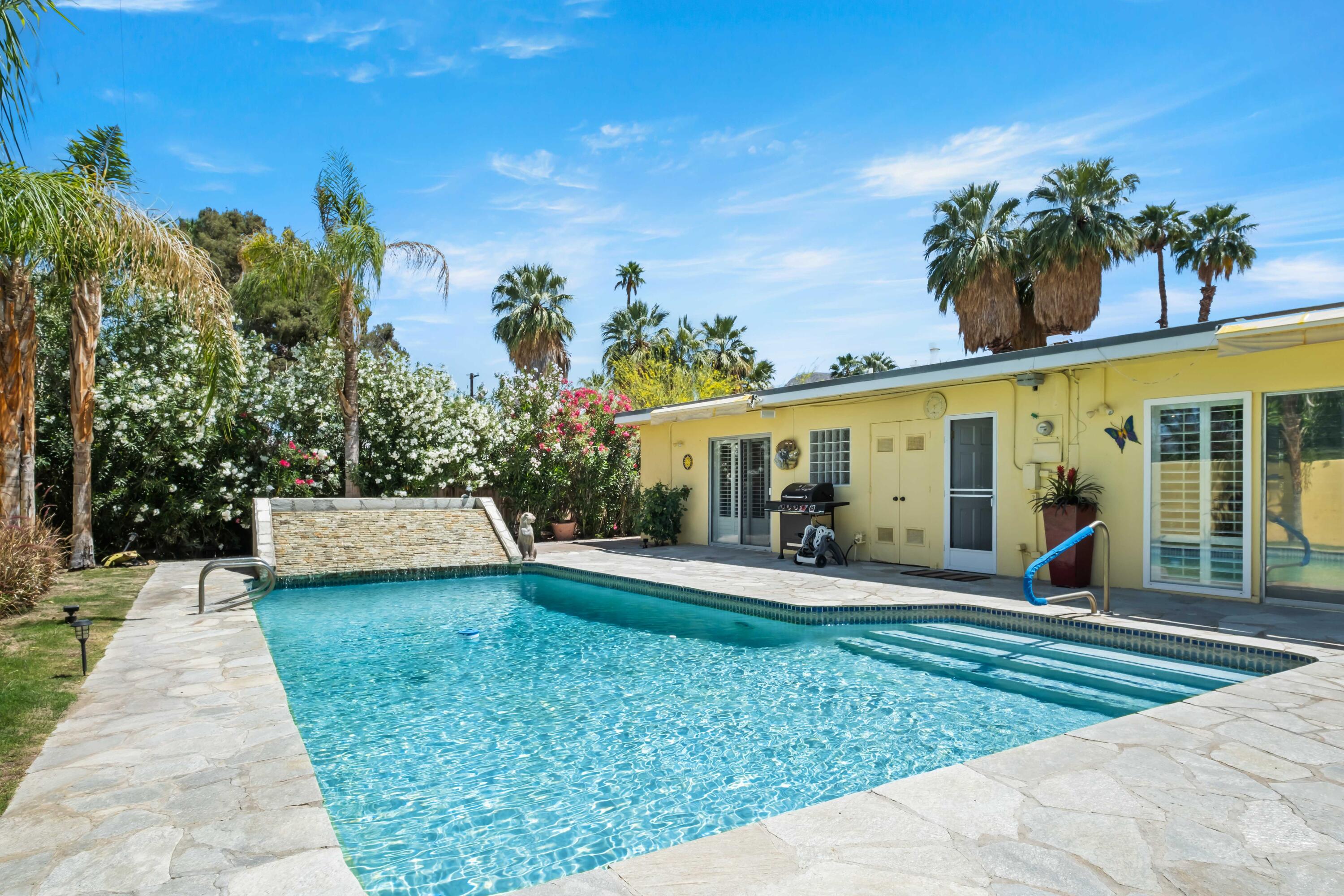 74460 Fairway Drive Palm Desert, CA 92260 - Photo 28 of 36 a view of a house with sitting area and garden
