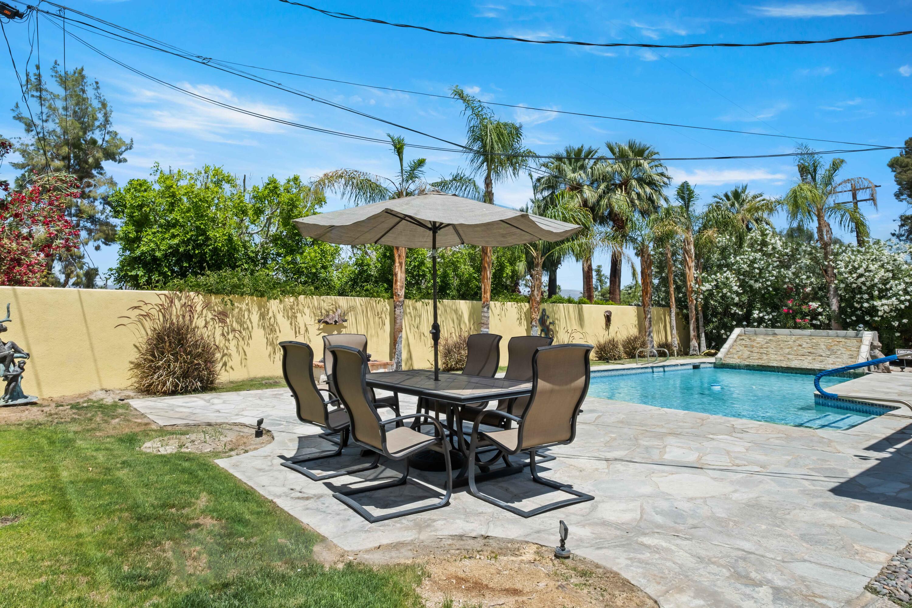 74460 Fairway Drive Palm Desert, CA 92260 - Photo 30 of 36 a view of backyard with outdoor seating and plants
