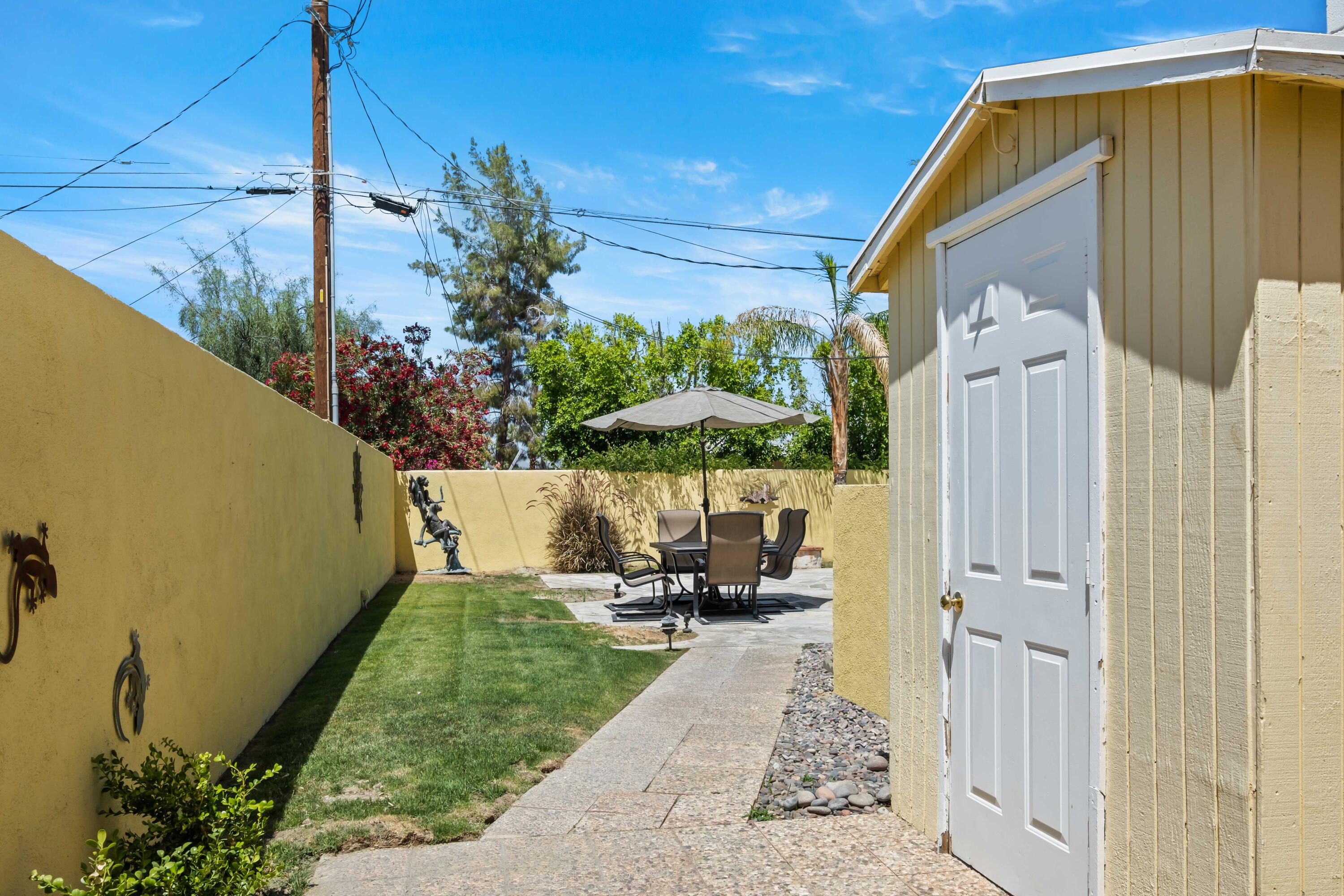 74460 Fairway Drive Palm Desert, CA 92260 - Photo 33 of 36 a house view with a outdoor space