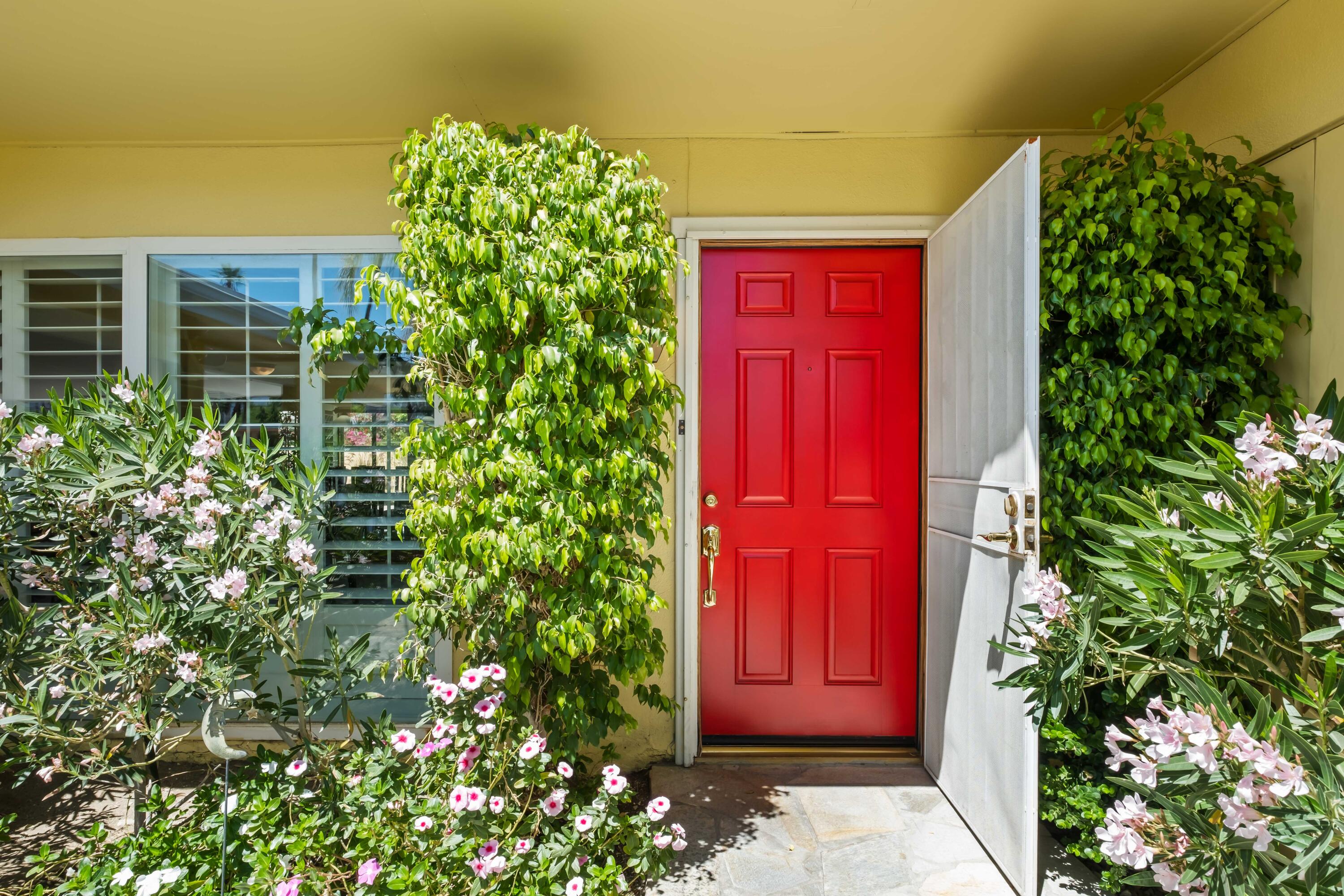 74460 Fairway Drive Palm Desert, CA 92260 - Photo 4 of 36 front view of a house with a red gate