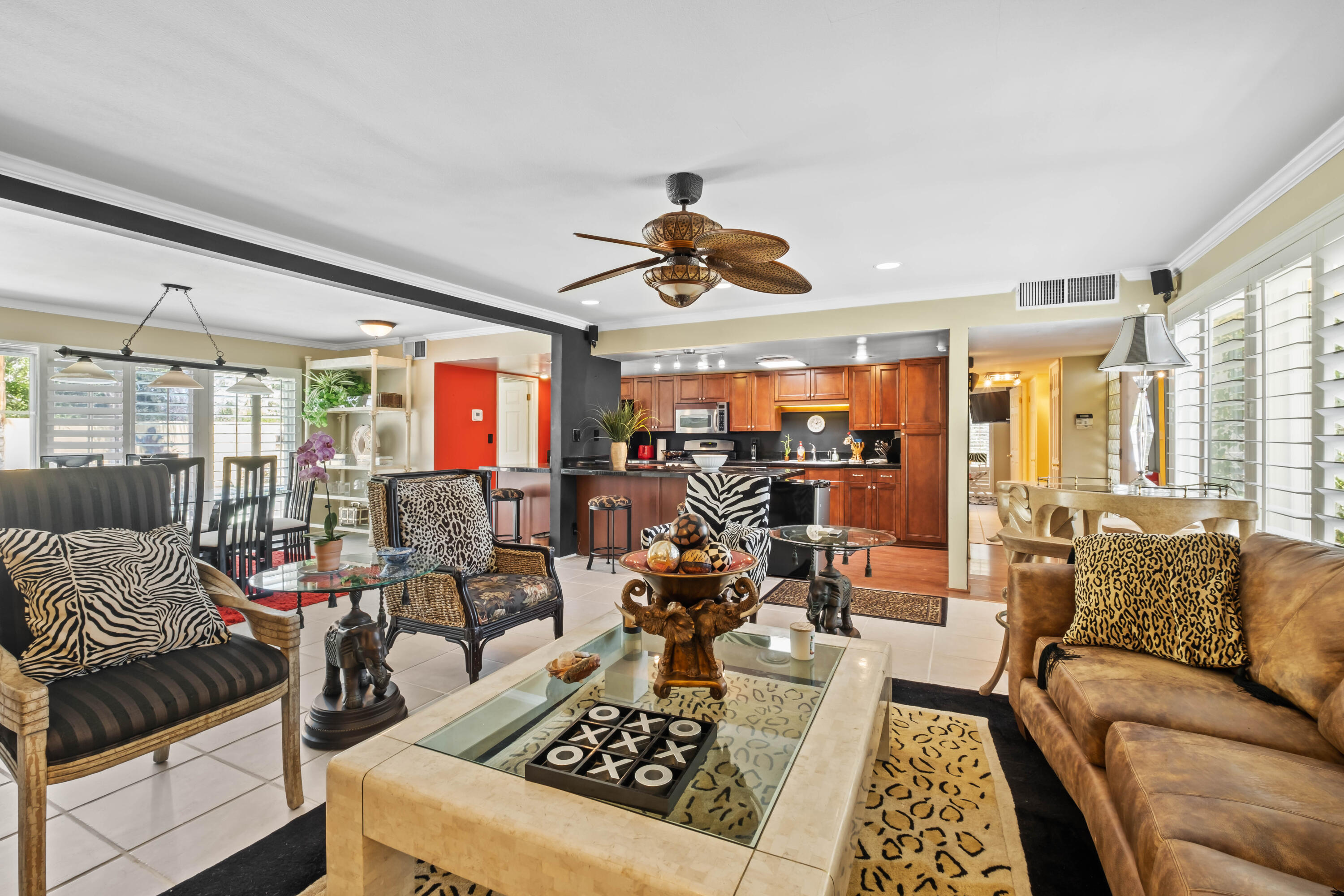 74460 Fairway Drive Palm Desert, CA 92260 - Photo 7 of 36 a living room with furniture ceiling fan and a rug