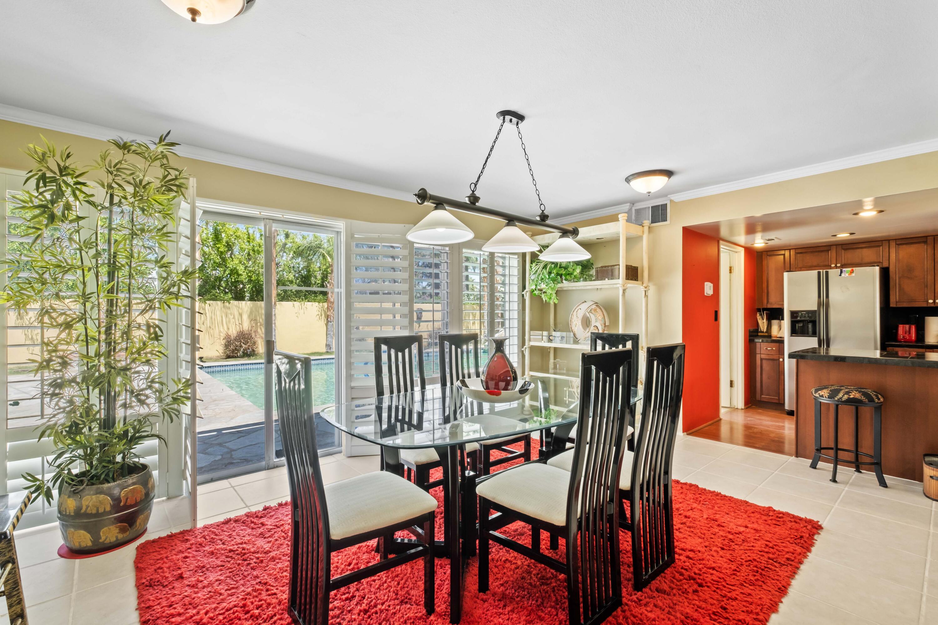 74460 Fairway Drive Palm Desert, CA 92260 - Photo 10 of 36 a view of a dining room with furniture window and outside view