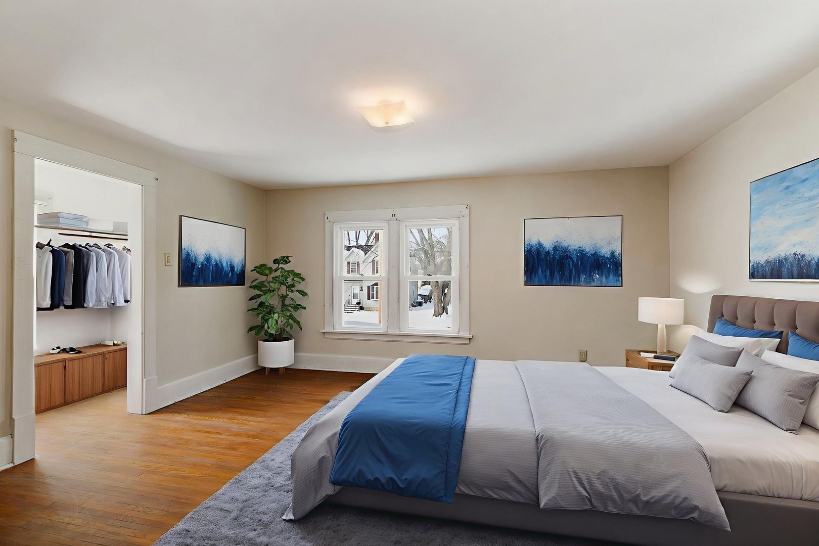 844 South 1st Street DeKalb, IL 60115 - Photo 19 of 26 a bedroom with a large bed and a couch