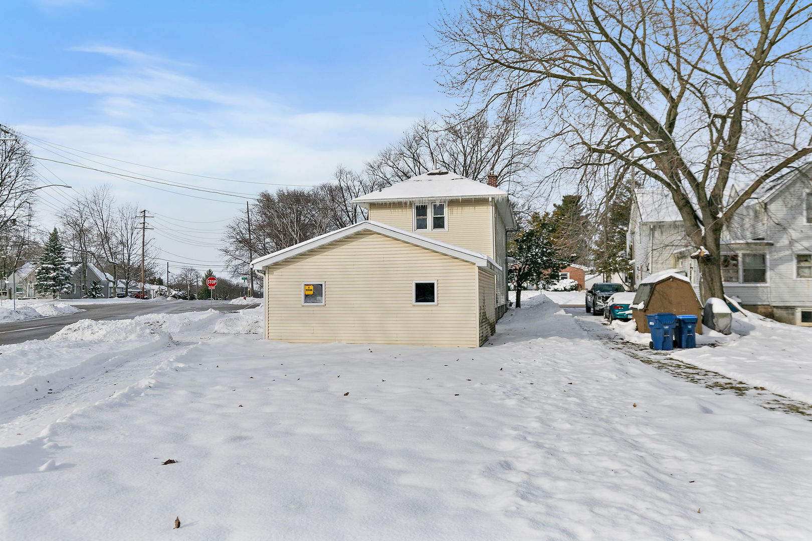844 South 1st Street DeKalb, IL 60115 - Photo 25 of 26 a view of a white house with a snow in front of it