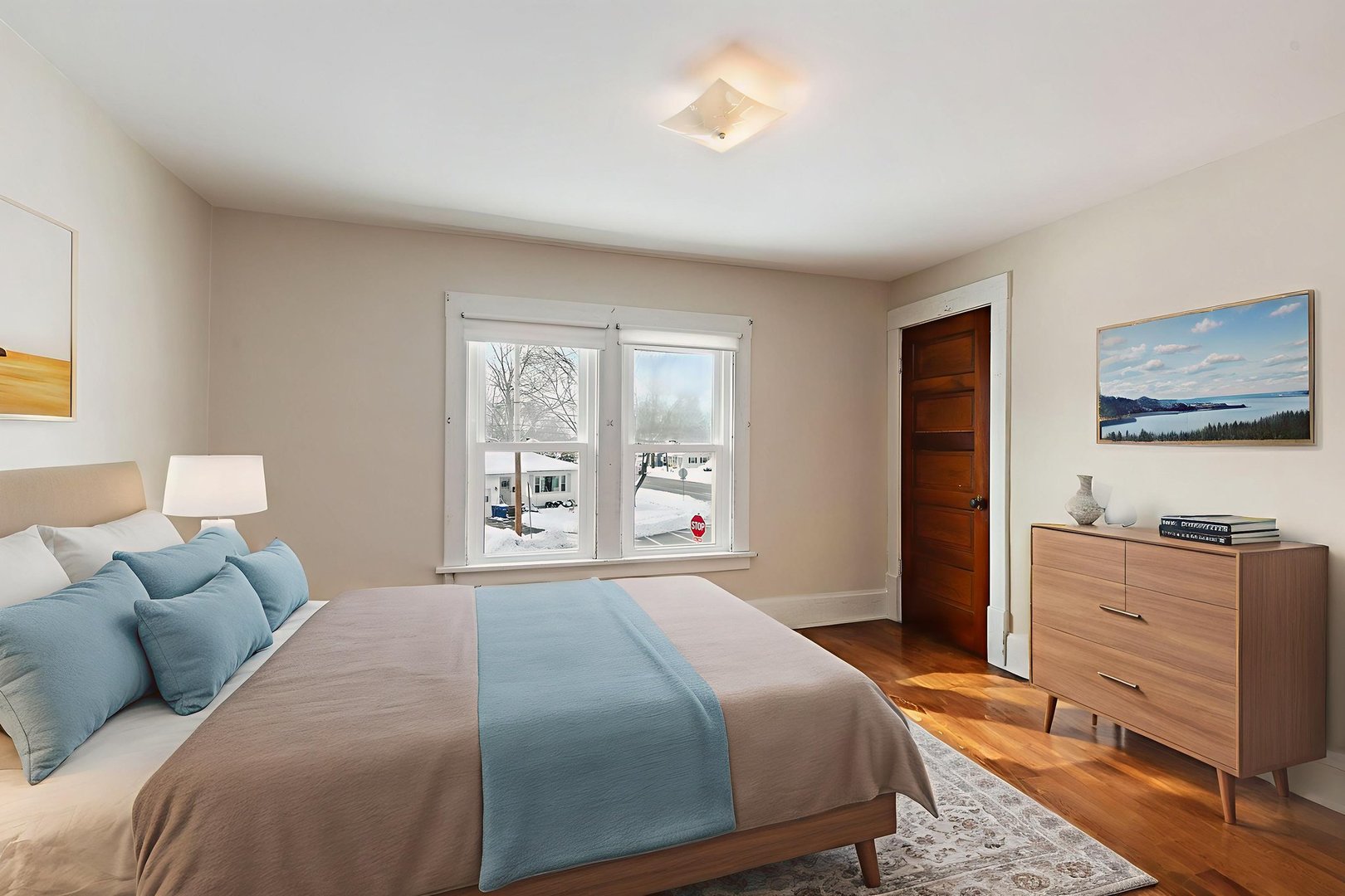 844 South 1st Street DeKalb, IL 60115 - Photo 26 of 26 a bedroom with a large bed and a window