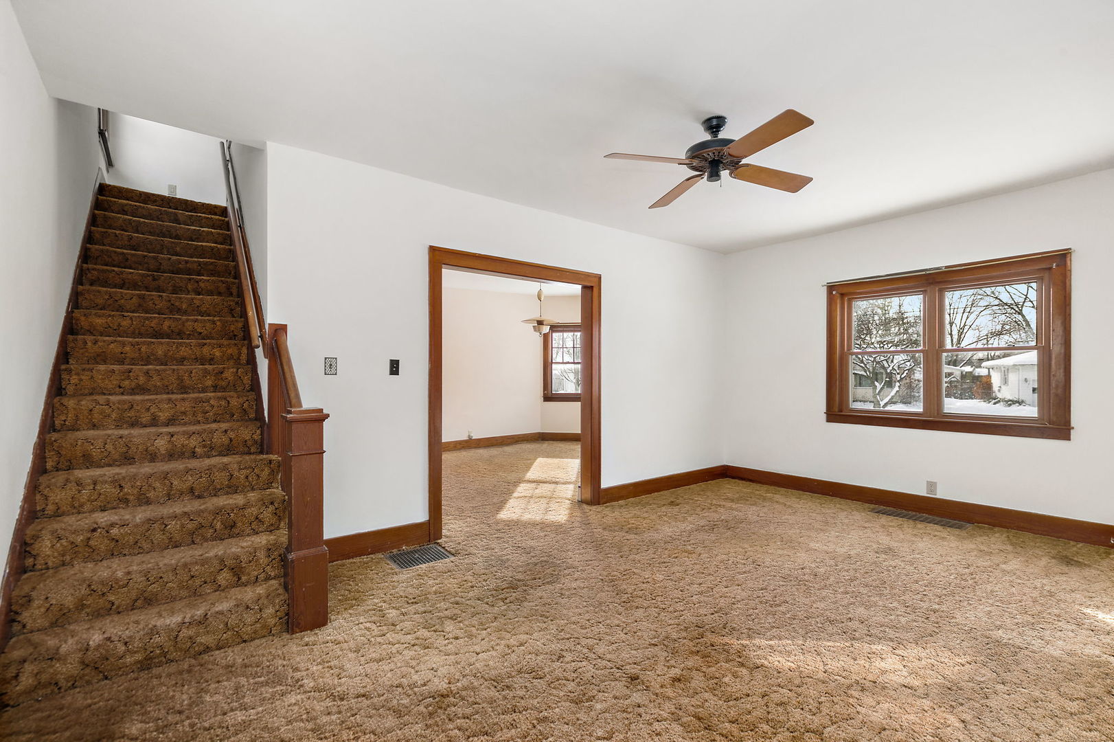 844 South 1st Street DeKalb, IL 60115 - Photo 4 of 26 wooden floor in an empty room with a window