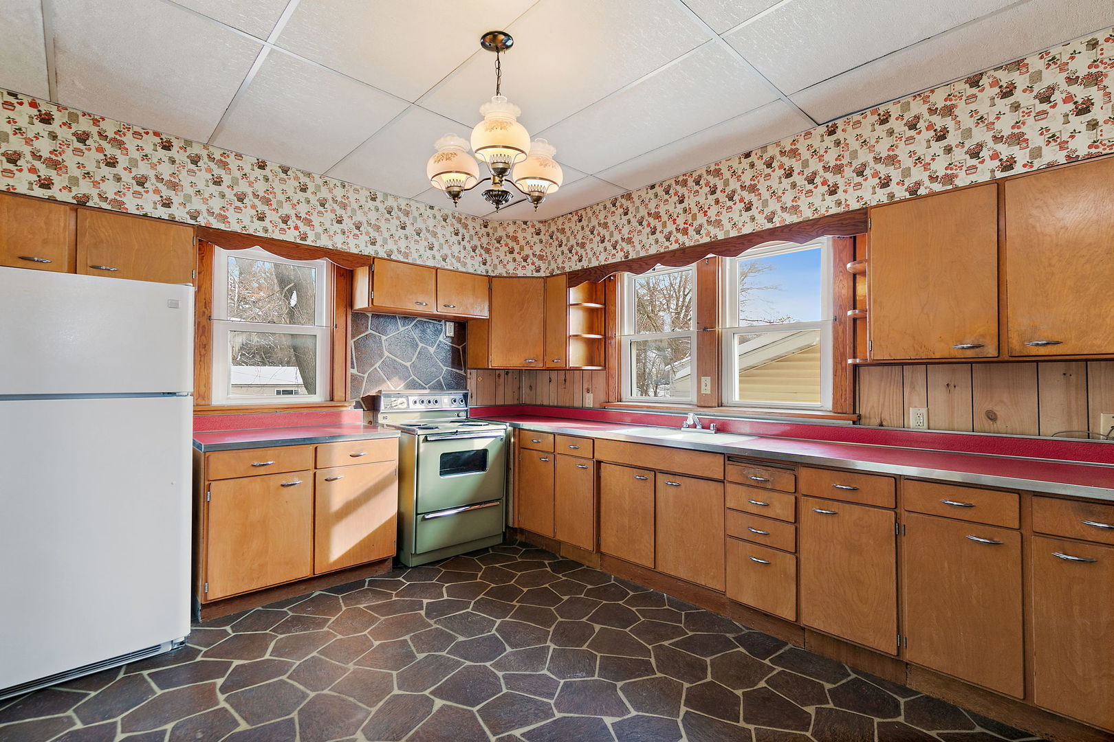 844 South 1st Street DeKalb, IL 60115 - Photo 10 of 26 a kitchen with stainless steel appliances granite countertop a sink and cabinets