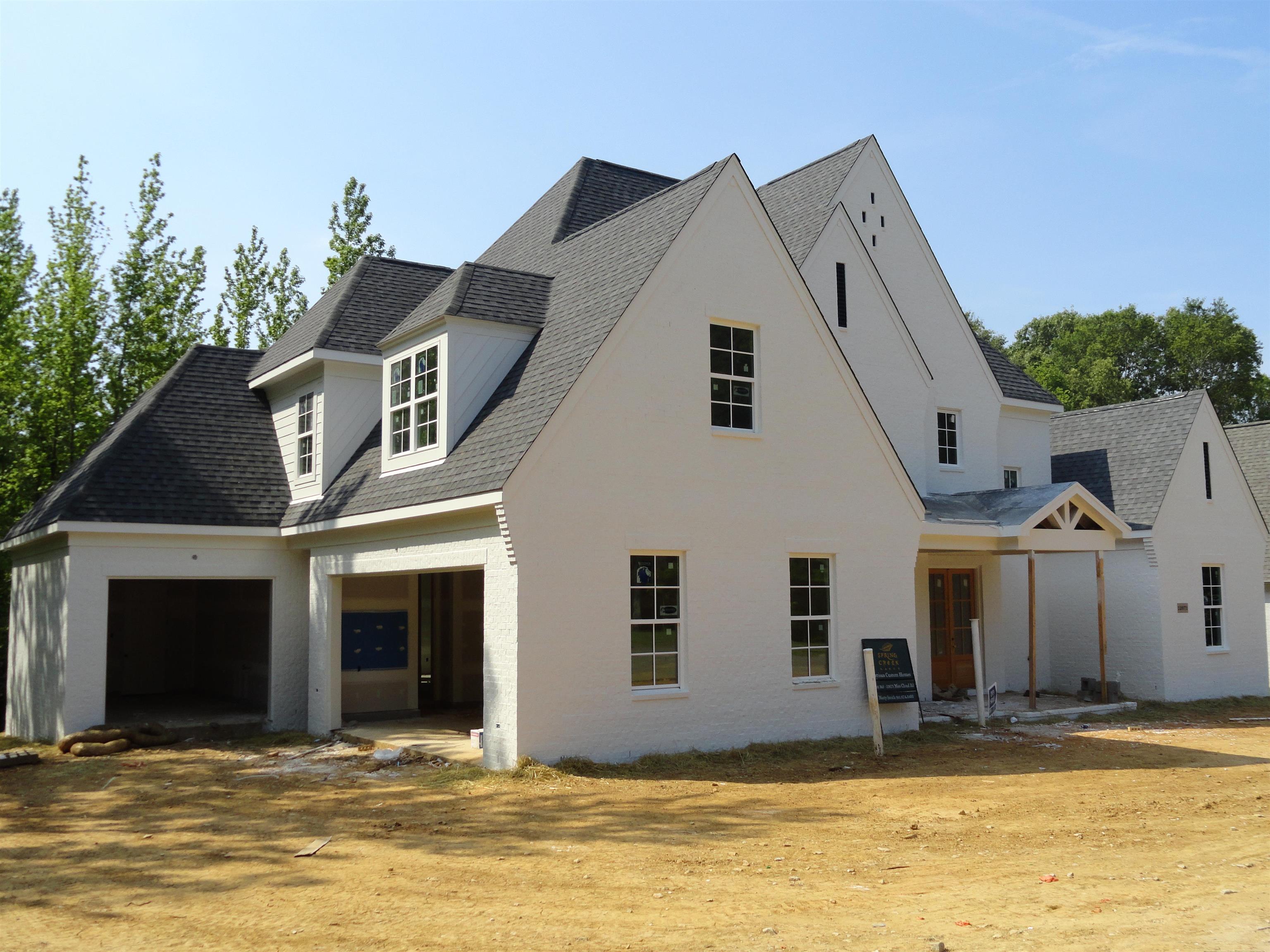 12671 Miss Cloud Road Collierville, TN 38017 - Photo 3 of 23 a view of a white house with a swimming pool
