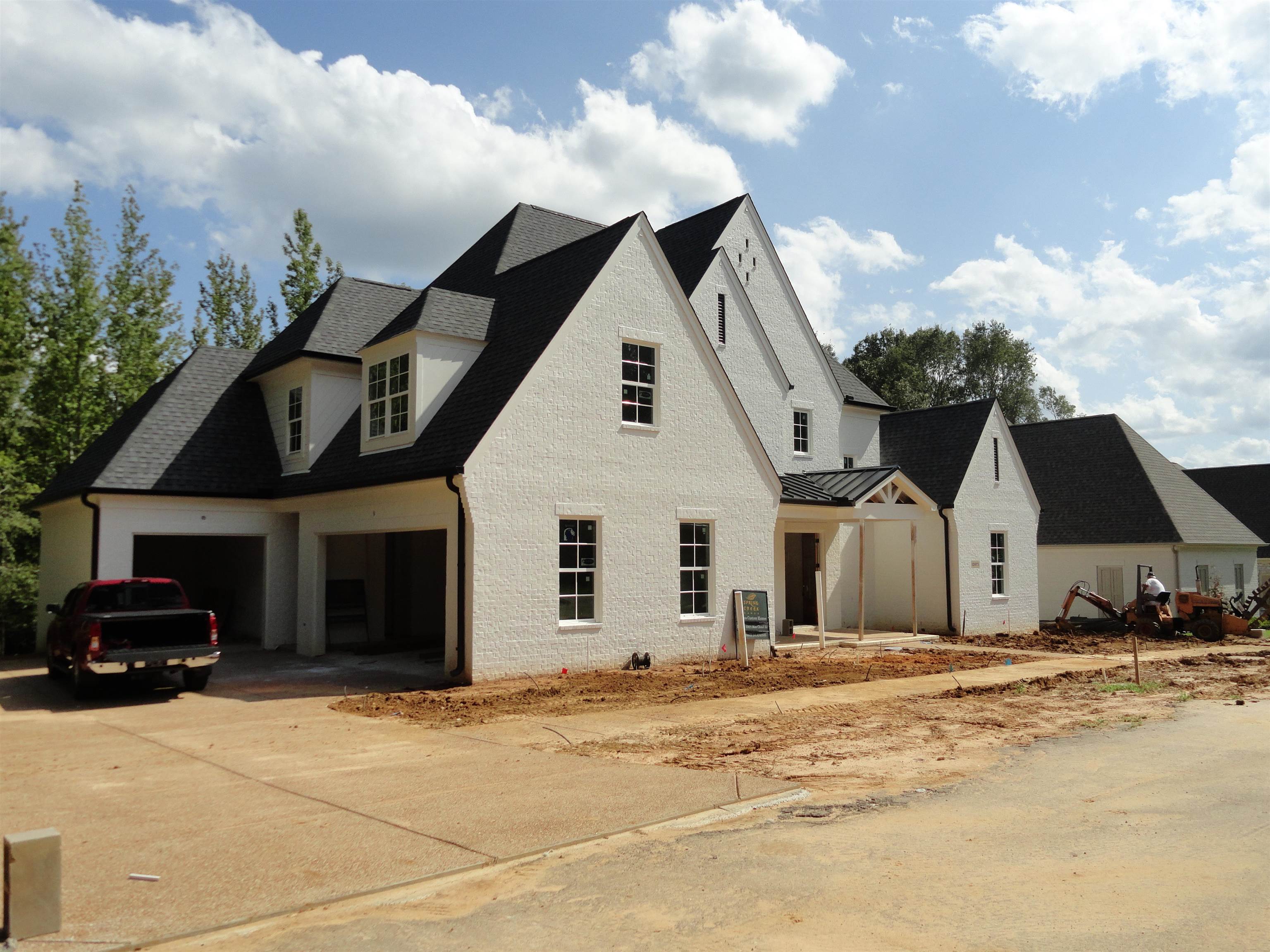 12671 Miss Cloud Road Collierville, TN 38017 - Photo 7 of 23 a view of a white house with a yard and large trees