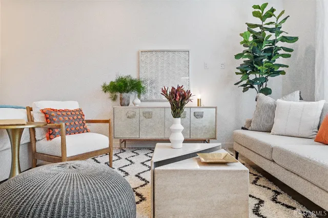 a bedroom with a bed and a potted plant