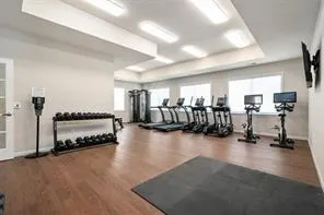a living room with lots of furniture and a large window