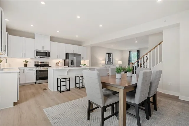 a dining room with kitchen island furniture a dining table and chairs
