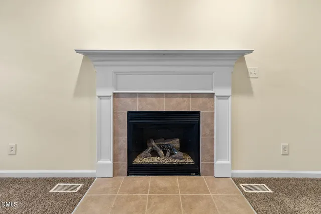 a living room with a fireplace