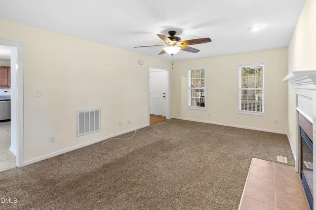 a view of an empty room with a window