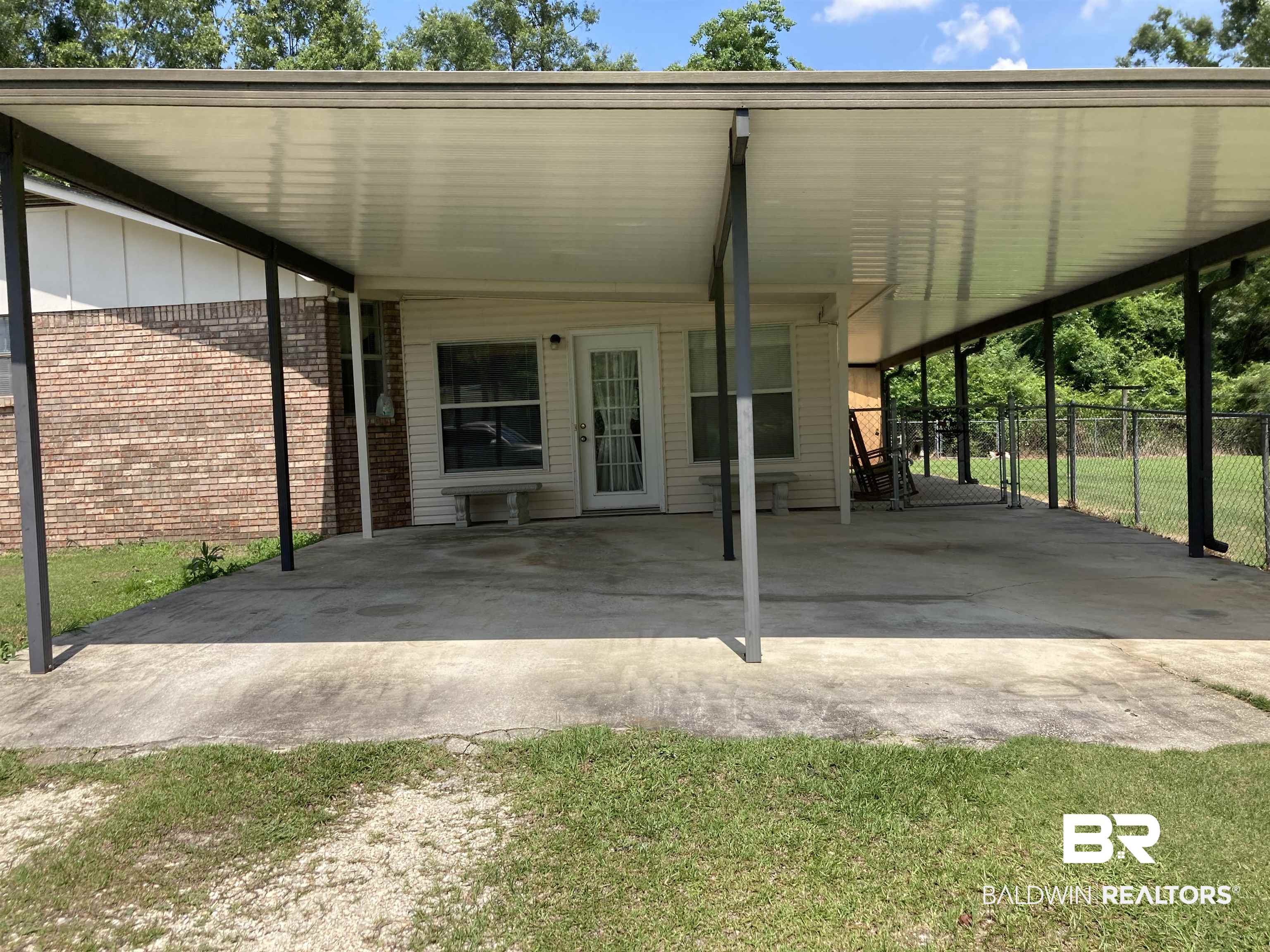 6151 Meadows Road Walnut Hill, FL 32568 - Photo 23 of 29 Exterior space with a carport