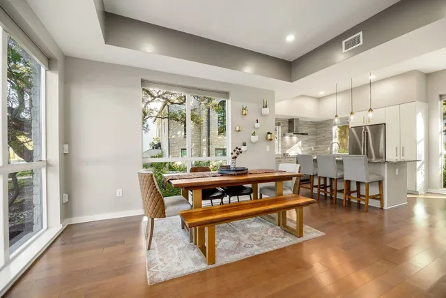 a view of a dining room with furniture window and outside view