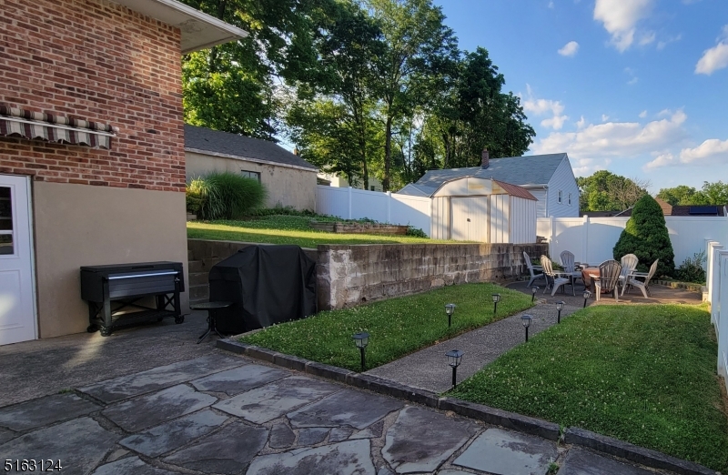 18 Howard Place, Unit 1 Nutley, NJ 07110 - Photo 16 of 17 a front view of a house with garden