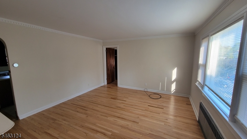 18 Howard Place, Unit 1 Nutley, NJ 07110 - Photo 3 of 17 a view of an empty room and glass door